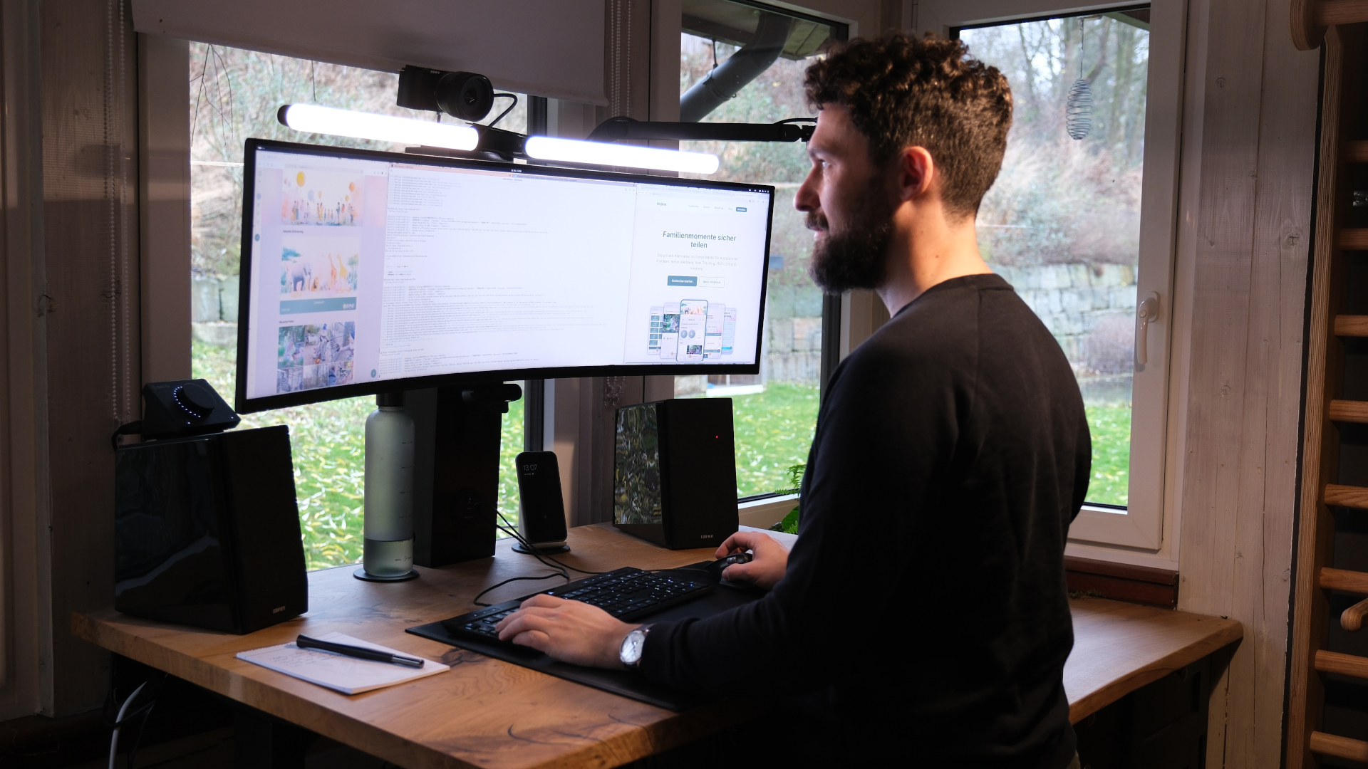Kore staring at a screen at his standing desk