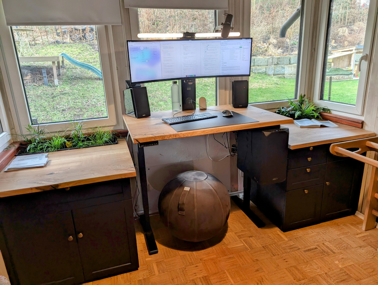 My self-built standing desk with garden view